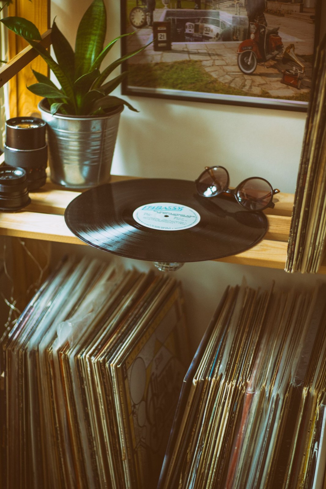 Vinyl records displayed above a record shelf